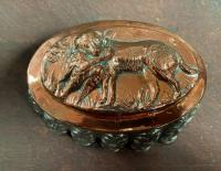 Vintage copper and tin mold with dog holding a pheasant