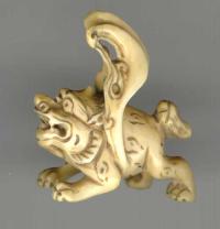 Antique Netsuke of a carved figure Ivory