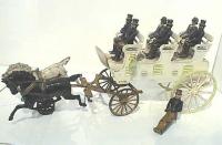 antique cast iron stagecoach with horses