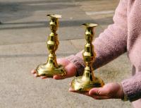 Pair of early brass push up candlesticks