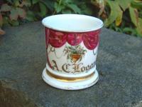 Antique porcelain shaving mug depicting drapes and flowers