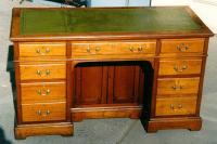 Antique English mahogany flat top desk with leather top