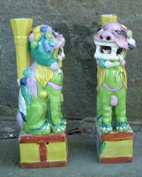 Pair of Chinese biscuit ceramic foo lion vases