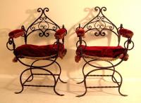 Pair of hand wrought Italian iron arm chairs with twist iron base c1890
