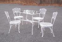 Wrought iron patio table and four matching chairs c1950