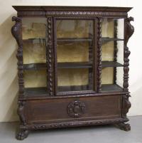 Carved fruitwood glass front china cabinet with bird corners 1875