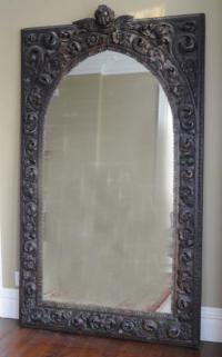 Hand carved wooden mirror with acanthus foliage flowers and putti
