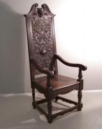 Victorian hand carved oak arm chair with griffins and urn c1860