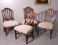 Set of four American Centennial inlaid upholstered shield back dining chairs