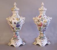 Pair of 19th c. Italian Nove faience porcelain lidded urns on bases