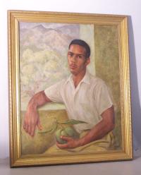 Portrait of Cuban or Carribean man holding mango