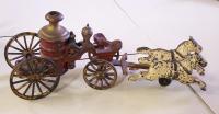Castiron toy firemans pumper wagon with horses