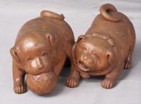 Carved wood model of two Japanese puppies with ball c1900
