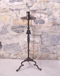 Early hand wrought iron torchiere with crest