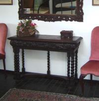 Oak console table with drawer carved with scrolls c1890