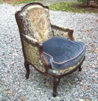 Louis XV style walnut bergere in tapestry and velvet upholstery
