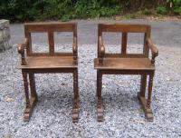 Pair of early primitive French church chairs c1700