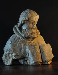 French 16th century limestone carving of a man with a book