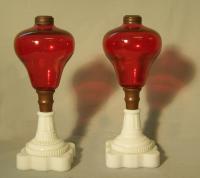 Pair hand blown cranberry and milk glass oil lamps c1850