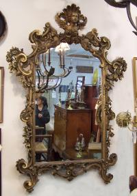 Late 18th early 19th century Continental wall mirror with angel top