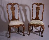 Pair Dutch Rococo marquetry chairs with figural splats c1700