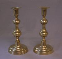 True pair of American brass push up candlesticks c1830