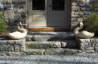 Large pair of hand carved swans by Kach