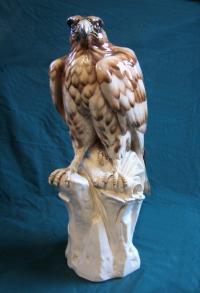 Large Continental porcelain figure of a falcon on a perch
