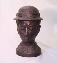 V Comley bronze head of a young woman with hat