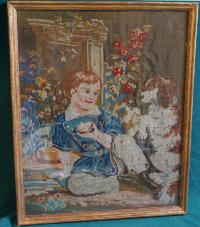 Antique needlepoint tapestry of a boy and his dog