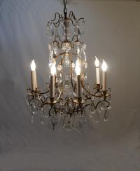 Vintage brass and crystal eight light cage chandelier