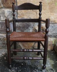 Antique child size ladder back arm chair c1900