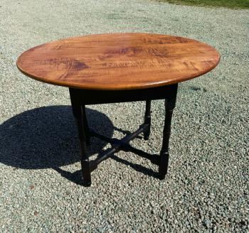 Image of D R Dimes tiger maple round table on black base