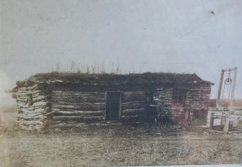 Image of 19th century photograph of log cabin