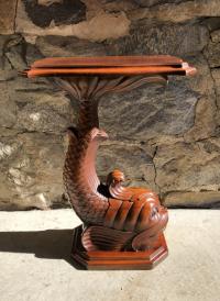 Artisan carved mahogany dolphin table