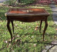 French Art Nouveau rosewood game table with brass inlay