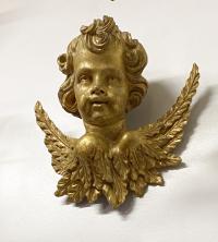 Antique hand carved cherub in gold leaf