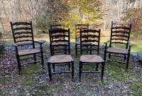 English oak chairs with wavy ladder backs and rush seats