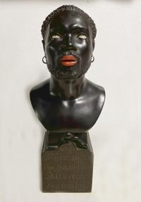 Rare ebony sculpture of a slave dated 1875