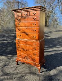 Eldred Wheeler tiger maple three-part Dunlop style chest on chest on frame c1750