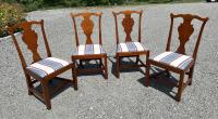 Four Eldred Wheeler tiger maple dining chairs in Chippendale style