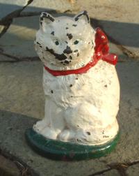 Antique or vintage castiron cat door stop