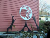 Modern steel sculpture Two Wolves Laughing at the Moon by Brian McCarthy