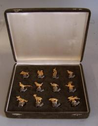 Boxed set of gold and silver animal place card holders c1900