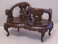 19th century Chinese carved courting chair with dragons