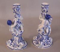 Pair of  Delft cherub  candlesticks c1900