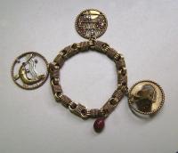 Van Cleef and Arpels France 18k gold charm bracelet