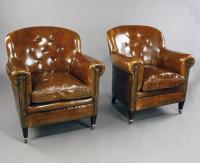 Matched pair of antique leather armchairs c1900