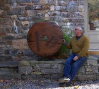 Early wooden oxcart wheel from single teak board