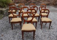 Set of 12 English early Victorian campaign chairs